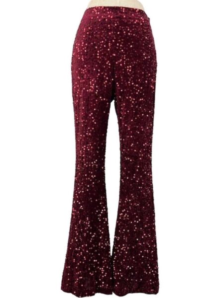 Pantalón acampanado de lentejuelas. Cremallera lateral invisible. 100% poliéster. Alabama Shop