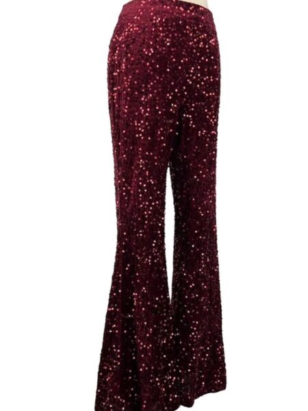 Pantalón acampanado de lentejuelas. Cremallera lateral invisible. 100% poliéster. Alabama Shop