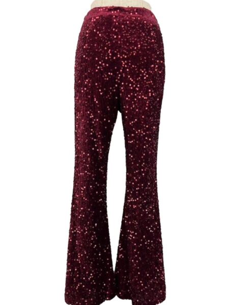 Pantalón acampanado de lentejuelas. Cremallera lateral invisible. 100% poliéster. Alabama Shop